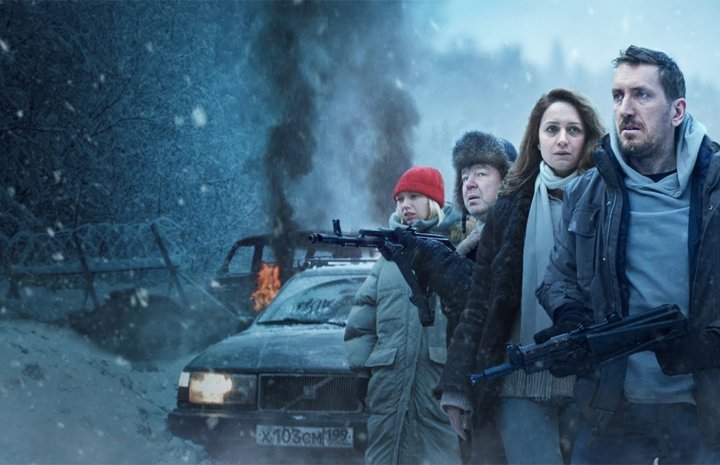 several people standing, a car, and smoke in air