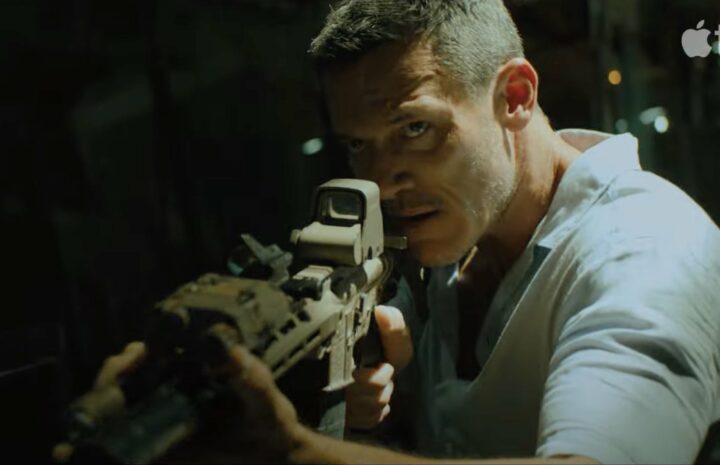 The man is holding gun in his hands.